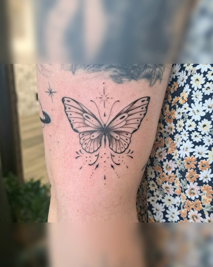 Delicate butterfly with ornamentals