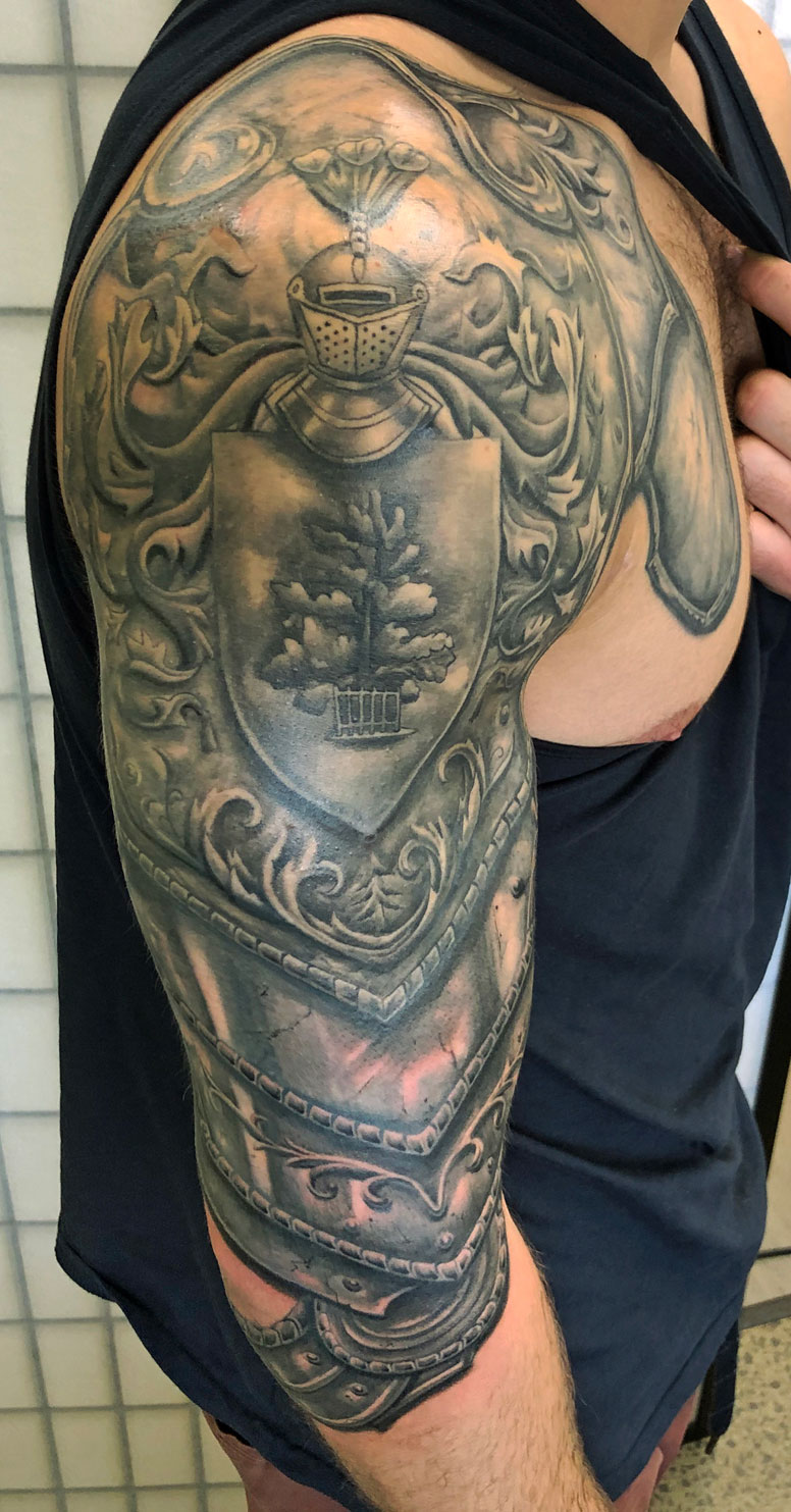 Black and grey armour tattoo with realistic shadowing - Auckland tattoo artist