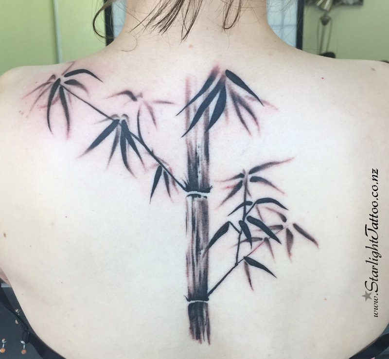 Bamboo tattoo in black and grey - minimalist nature ink