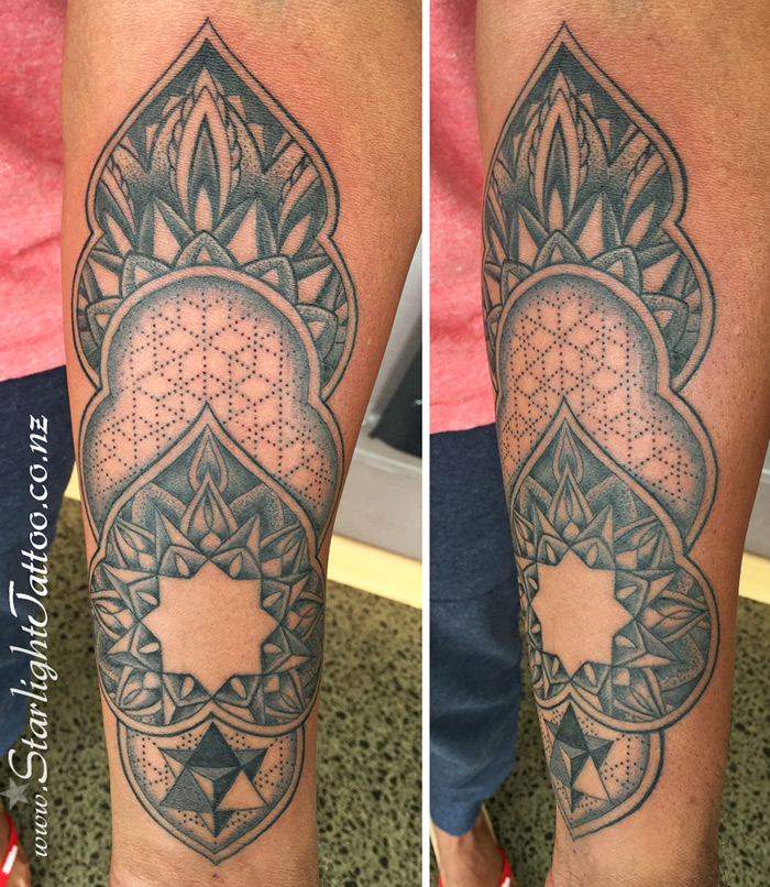 Mandala tattoo on forearm - spiritual black and grey design