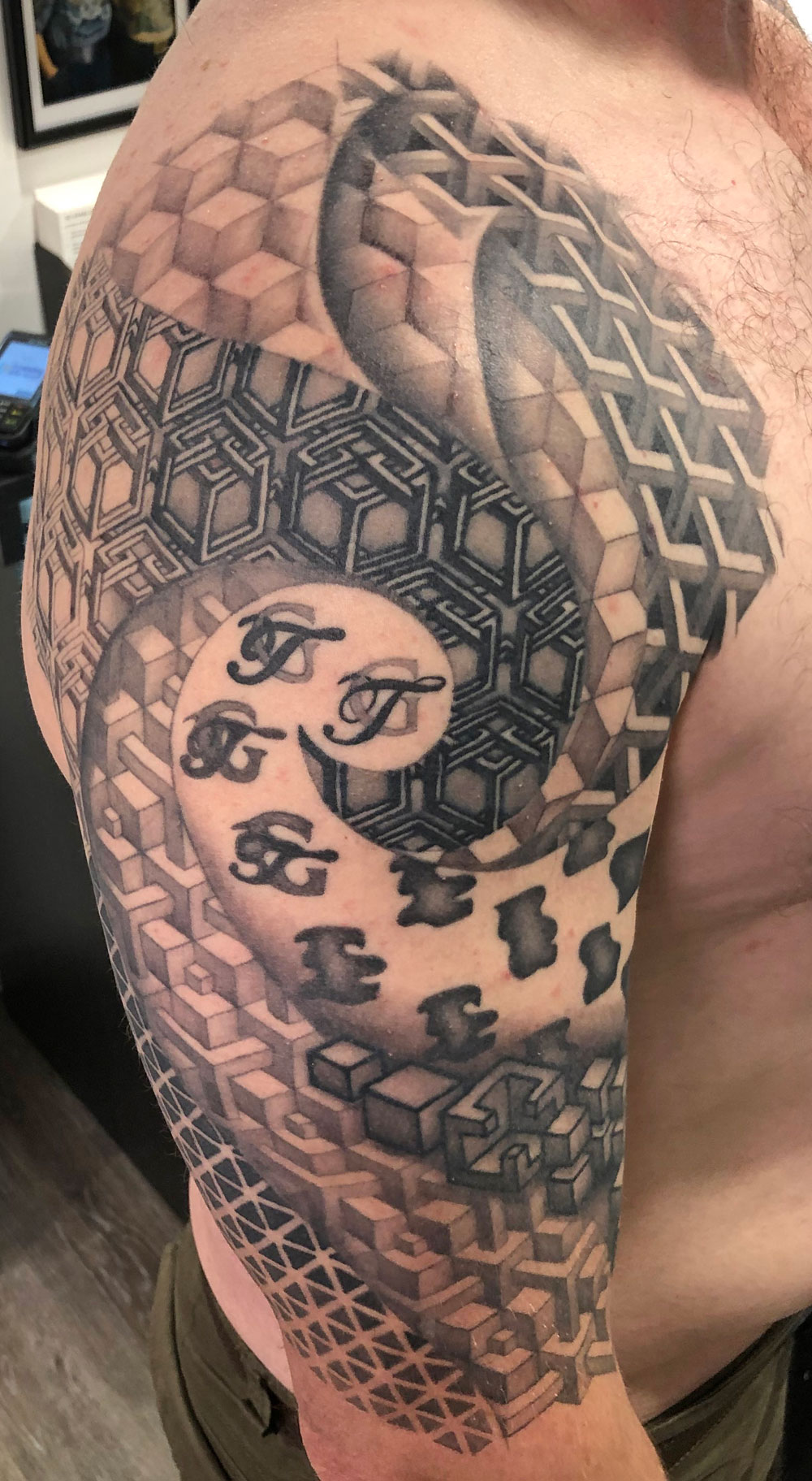 Geometric tattoo in black and grey - clean symmetry