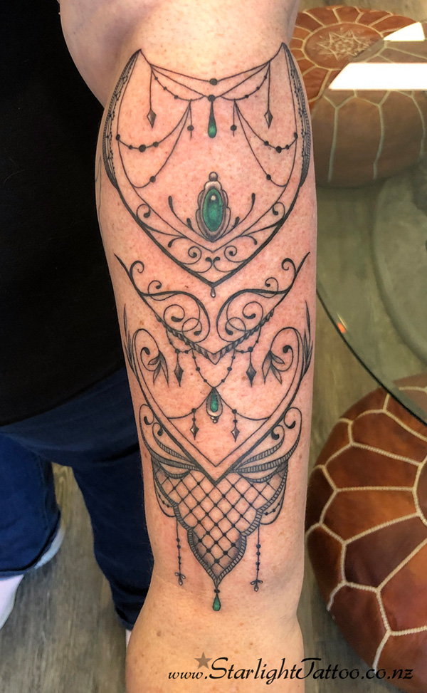 Hanging beads tattoo - ornamental detail