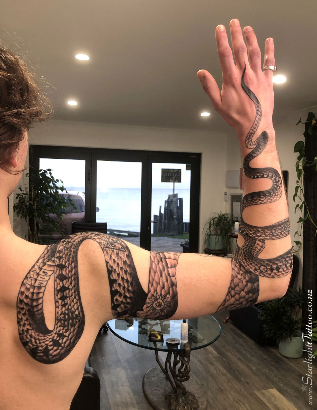 Mystical magick sigil tattoo in black and grey - occult-themed ink