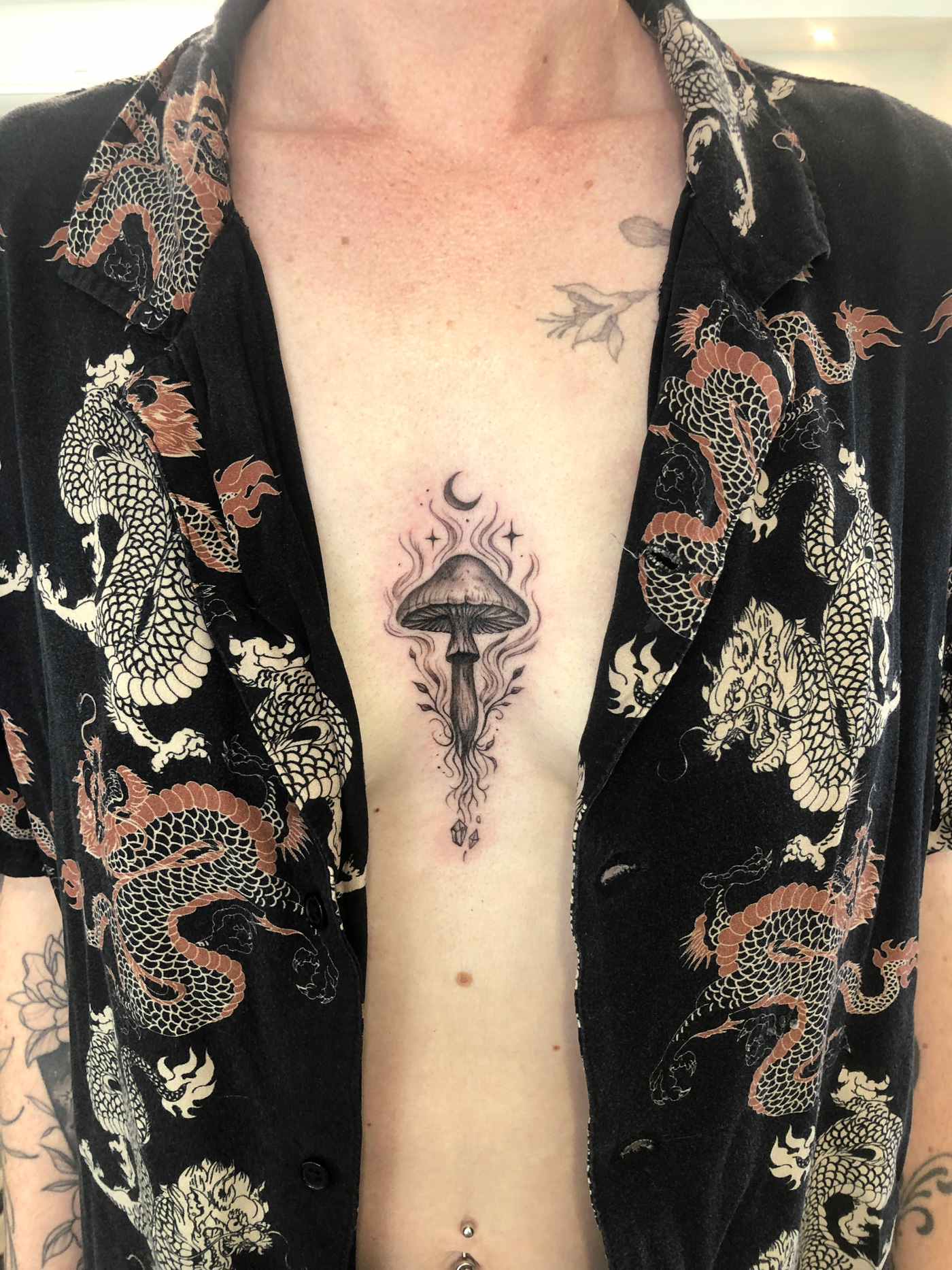 A mushroom rises beneath the crescent moon