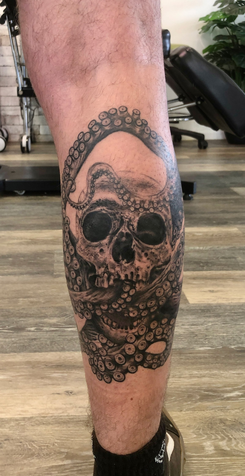 Octoskull tattoo - black and grey skull fused with octopus