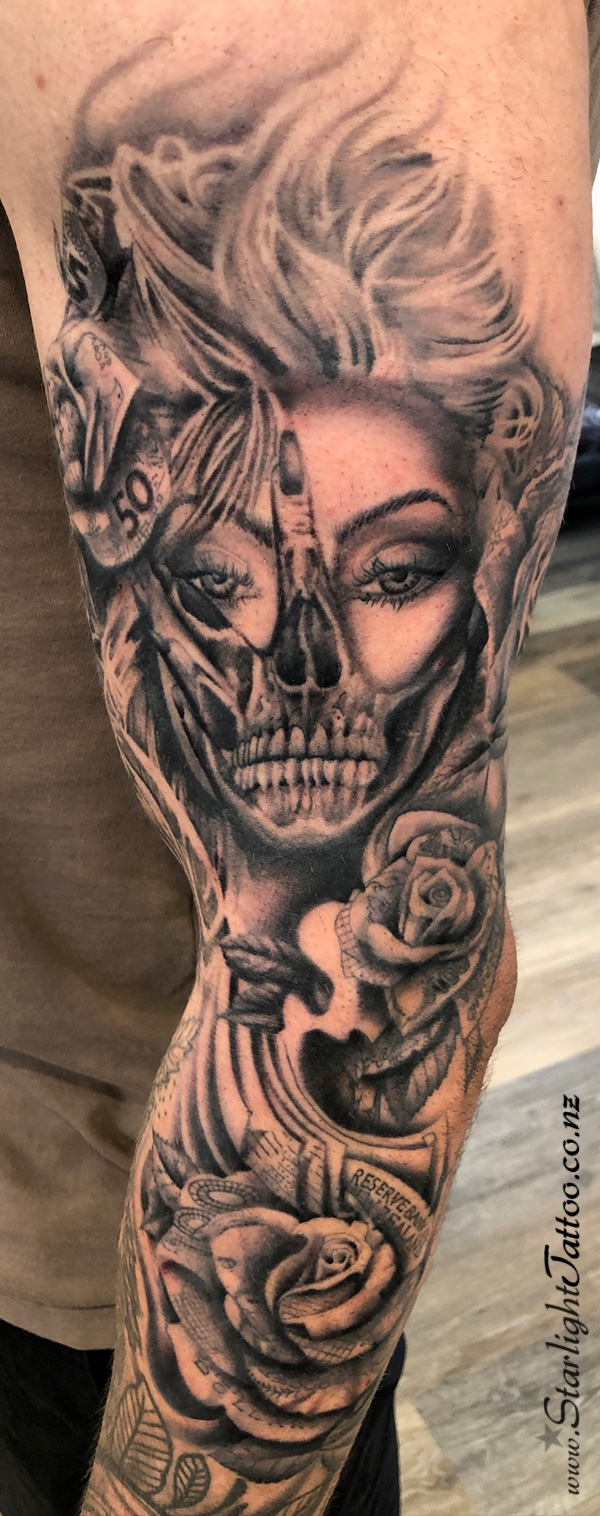 Skull and hand tattoo