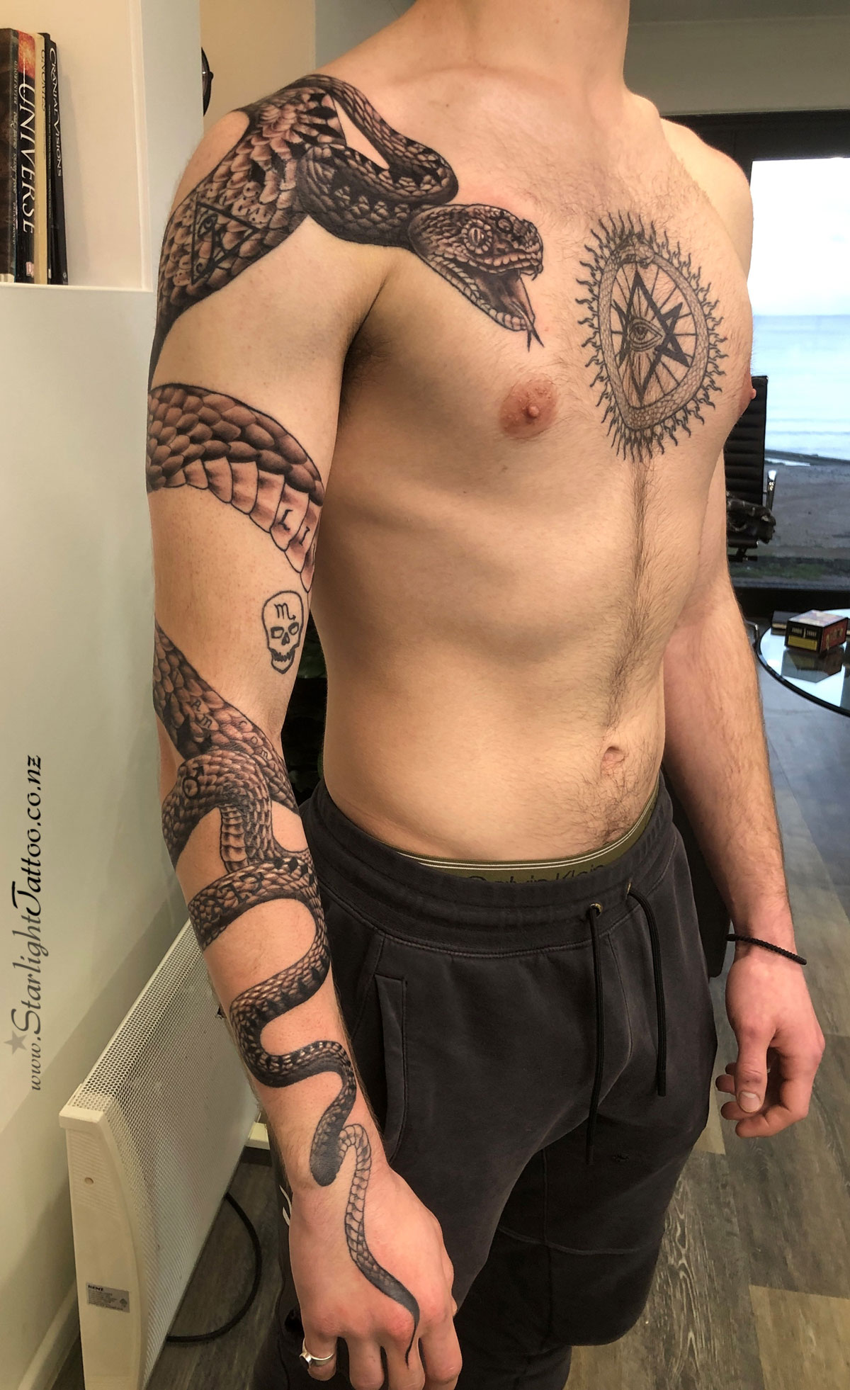 Snake sleeve tattoo in black and grey