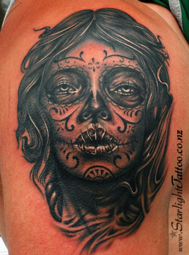Sugar skull face tattoo - grayscale realism with cultural meaning