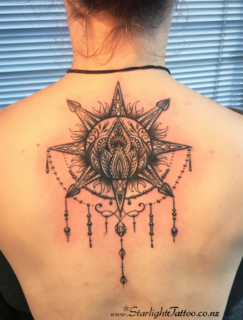 Sun mandala tattoo - black and grey spiritual symbol