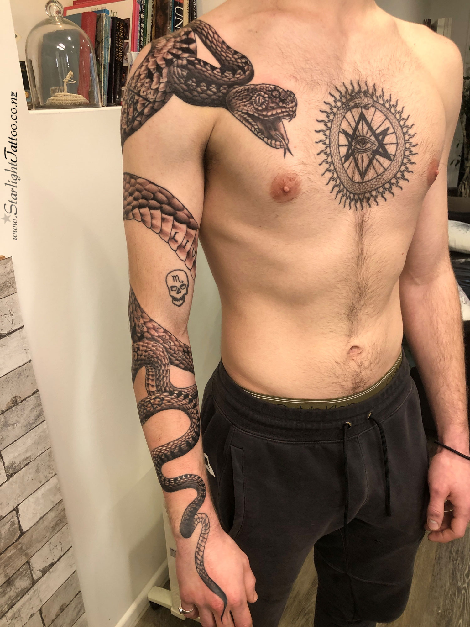 Thelema-inspired tattoo in grayscale - symbolic occult design