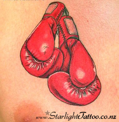 A colourful tattoo featuring boxing gloves - colour tattoos Auckland