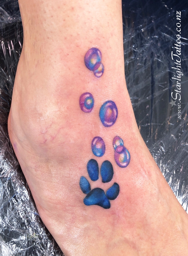 Colourful paw print with whimsical bubble effects - custom ink Auckland
