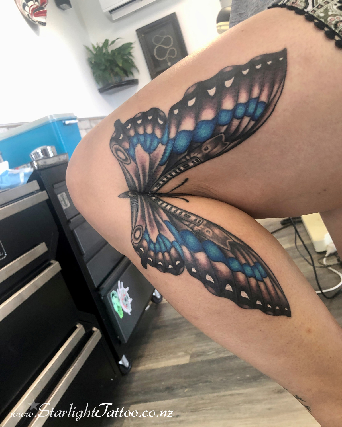 Sharp meets serene in this butterfly knife piece - Custom colour tattoo Auckland