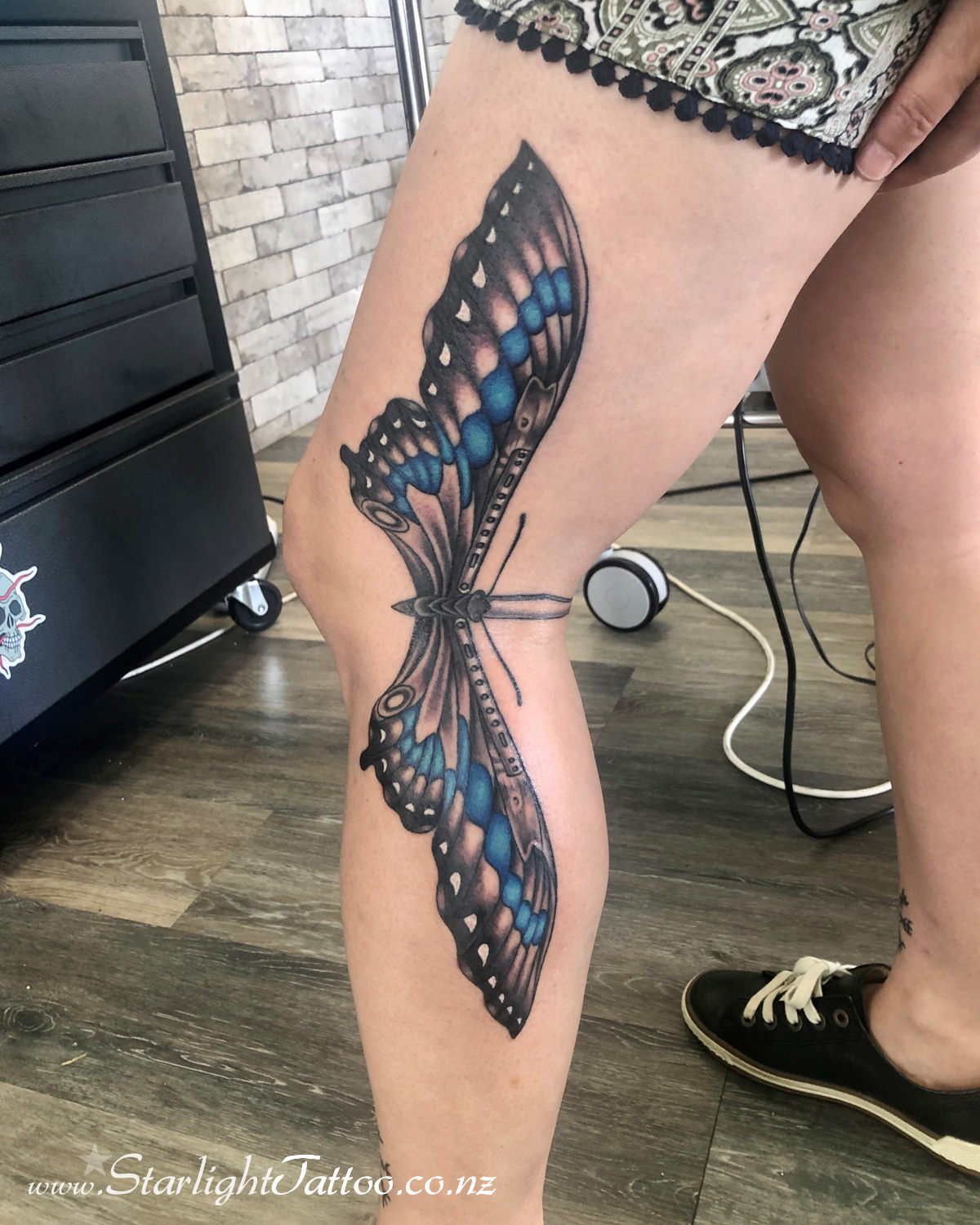 Butterfly knife ink design with surreal transformation