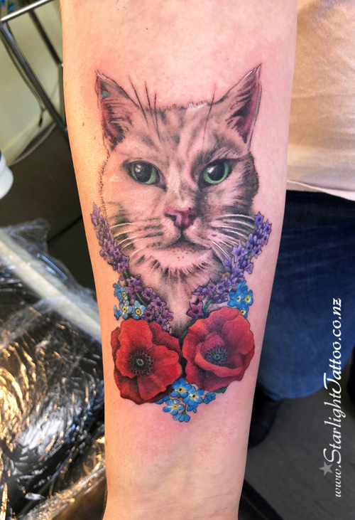 A colourful tattoo featuring a cat - Auckland tattoo artist