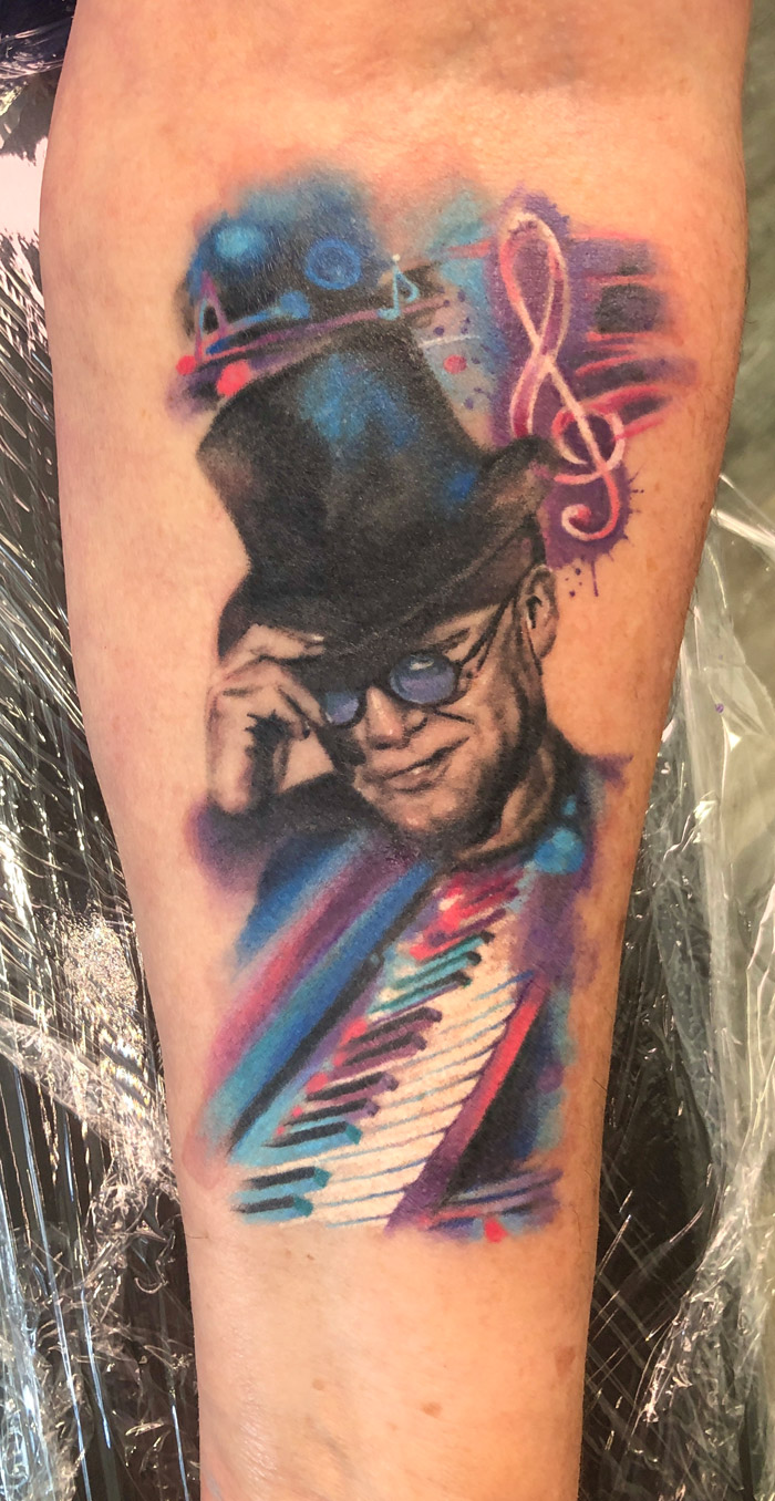 Elton John and watercolour tattoo