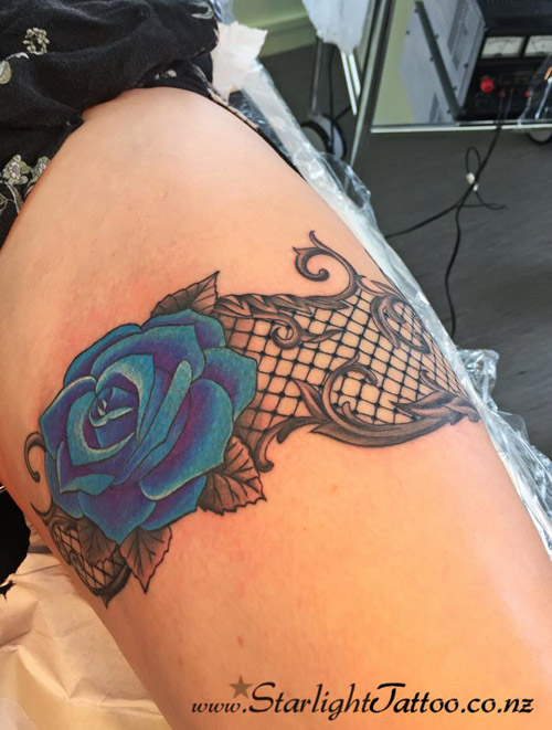 Expressive tattoo art of garter design - inked in Auckland