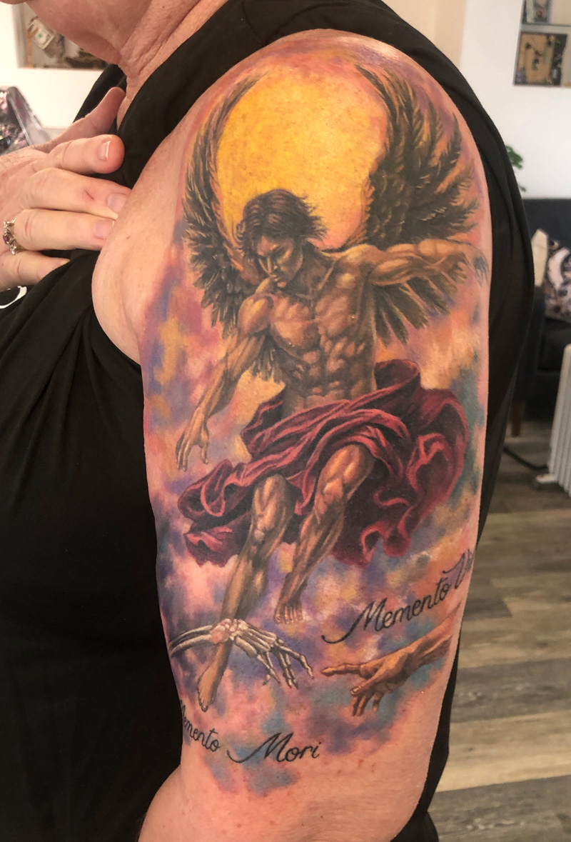 Guardian angel tattoo in classic colour realism - A symbol of protection, guidance and an enduring connection to the light.