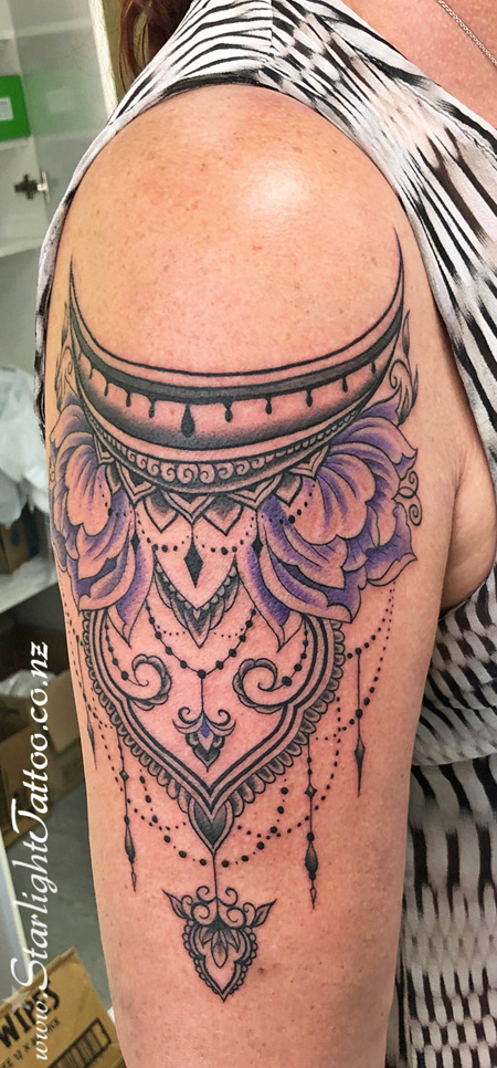 Nice - artistic tattoo crafted with colour and meaning
