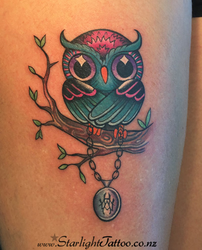 Cute owl tattoo with wide eyes