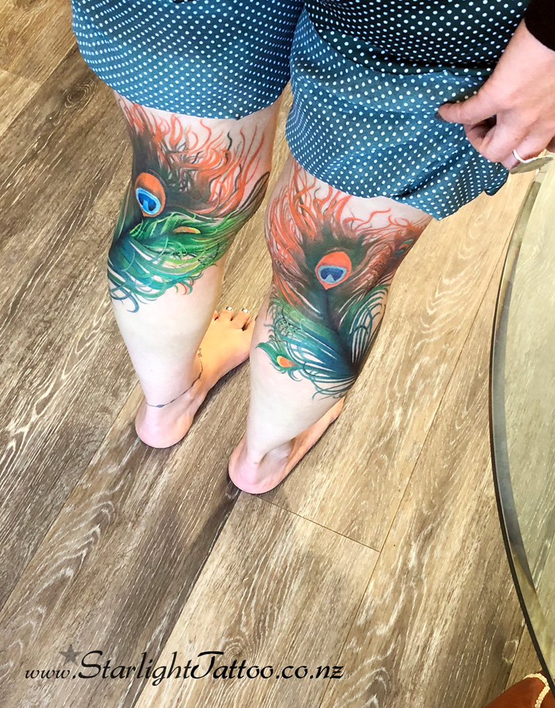 Vibrant peacock feather tattoo with layered colour - fantasy ink Auckland