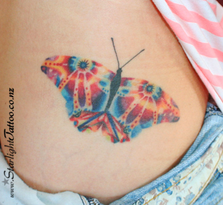 Butterfly tattoo with dreamy psychedelic palette - surreal colour style
