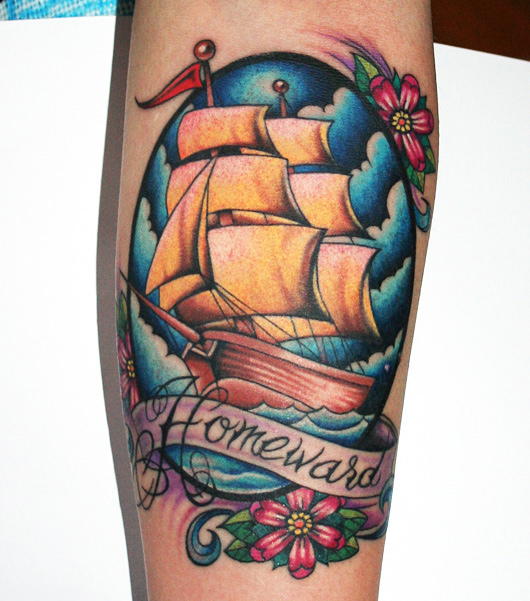 A colourful tattoo featuring a sailing ship