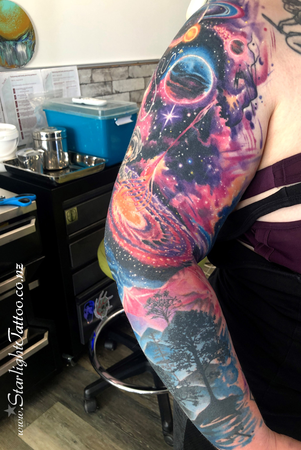 Planets, nebulae, and constellations align in this vivid space sleeve
