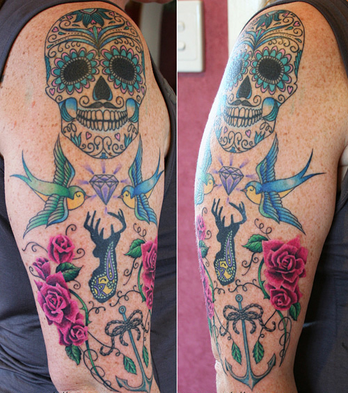 A vibrant depiction of sugar skull tattoo - detailed colour ink work