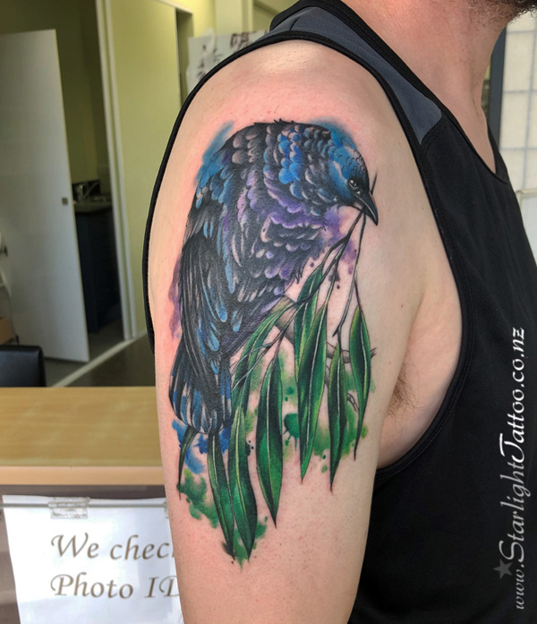 Detailed design of watercolor raven - colourful body art