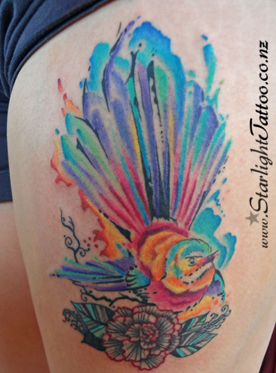 A colourful tattoo featuring watercolour - colourful body art