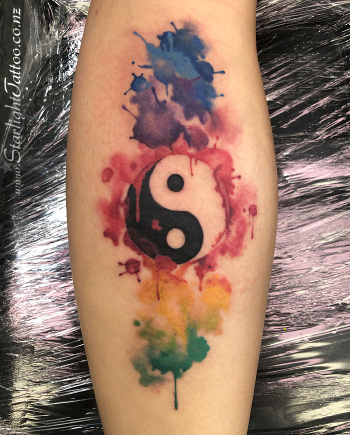 Fusion-style yin and yang tattoo in radiant ink - Auckland tattoo artistry