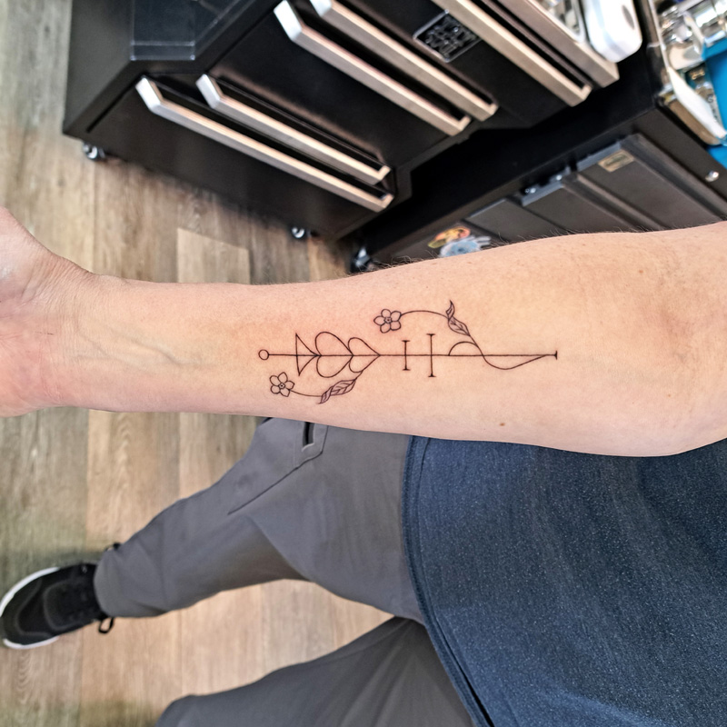 Sigil tattoo on the forearm.